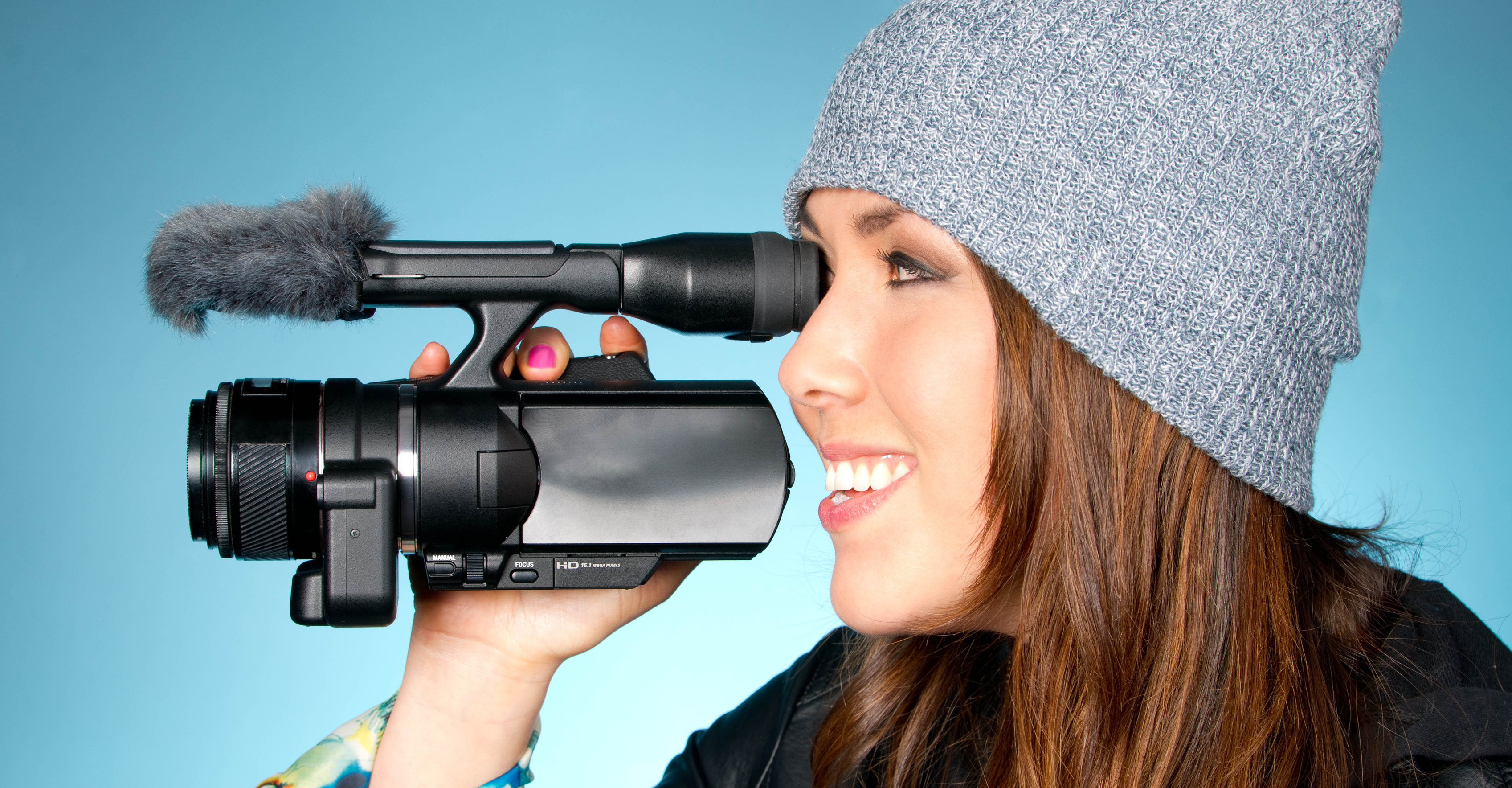 Hip Young Adult Female Points Video Camera